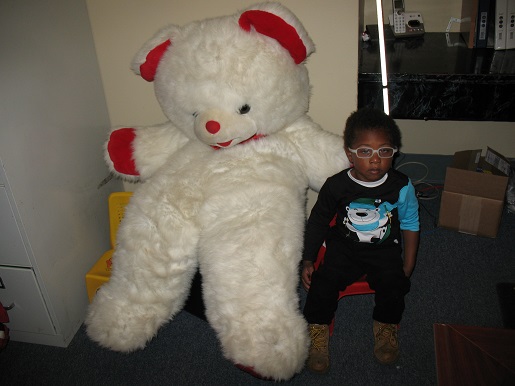 A child and the Christmas Teddy Bear